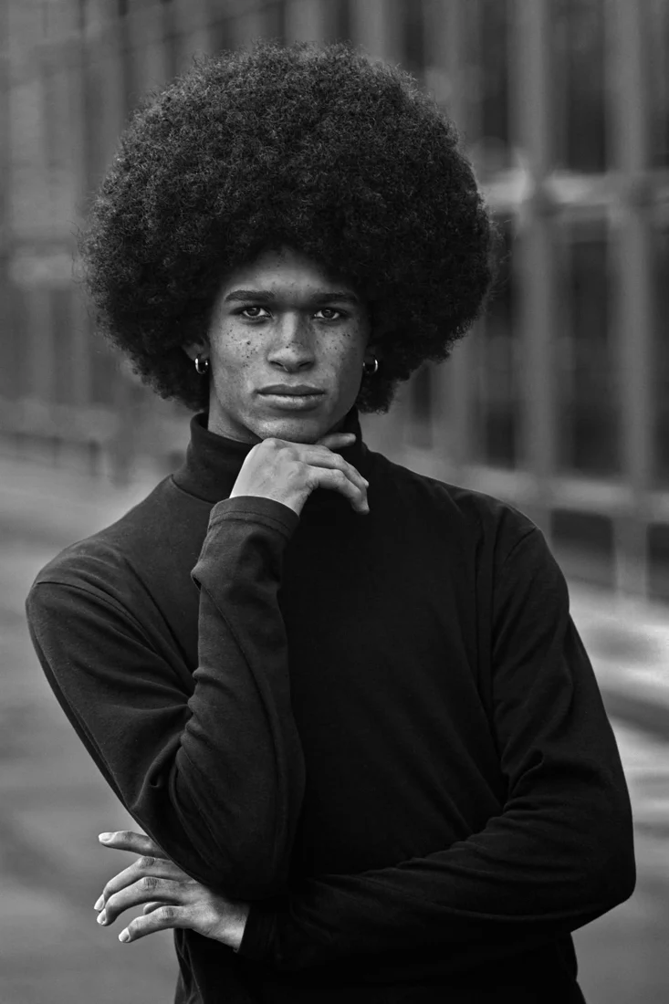Portrait of a man with his hand at his chin