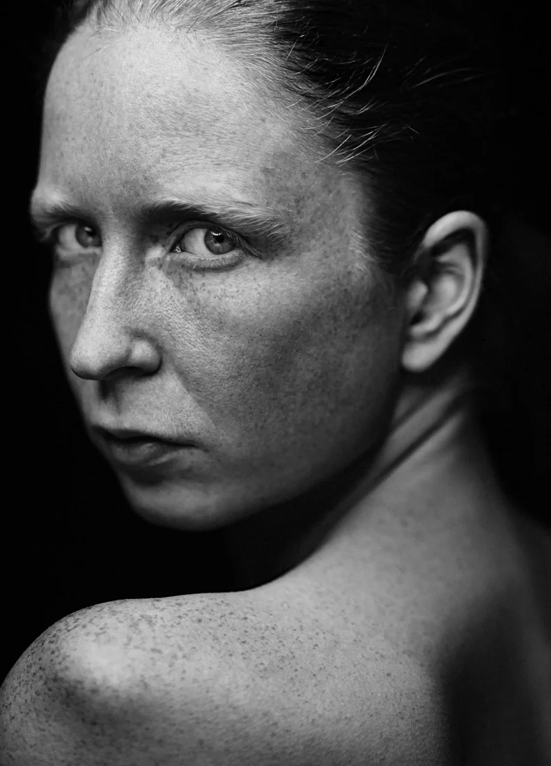 Close-up of a woman with freckles