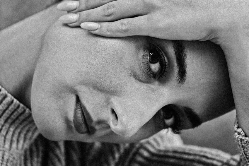 Portrait of a girl with her hand by her head