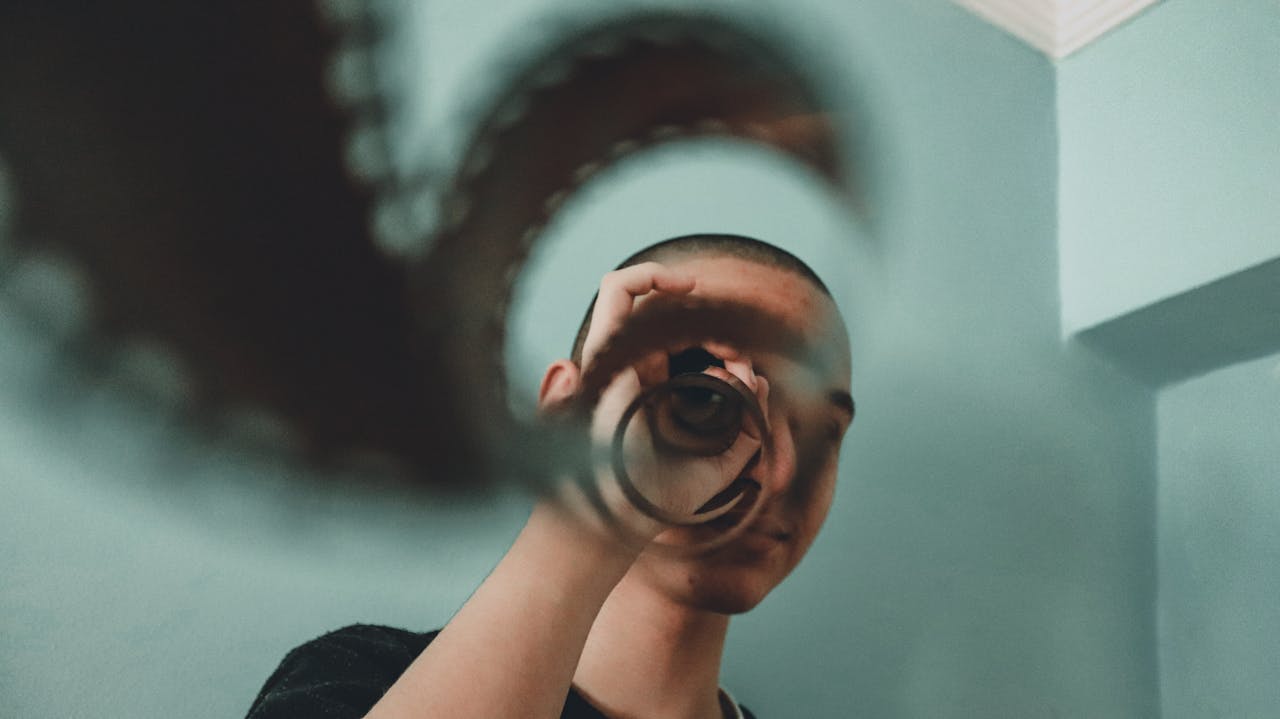 Woman in Black Shirt Holding Her Head